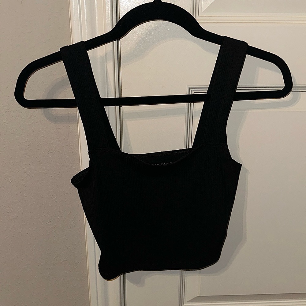 This is a small and black American eagle tank top